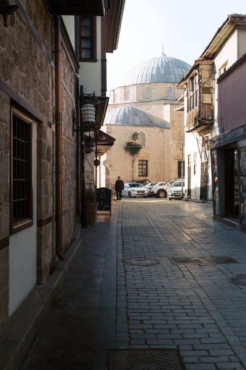 Free Charming narrow street with view of a mosque in Antalya, highlighting traditional architecture. Stock Photo
