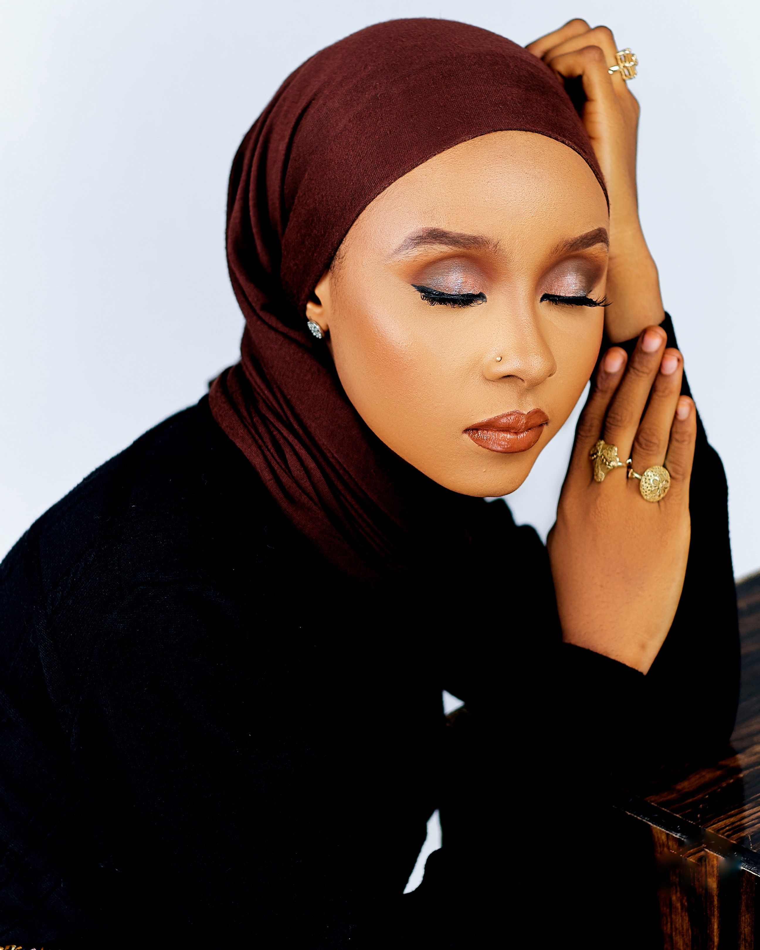 Elegant Woman in Brown Hijab with Jewelry · Free Stock Photo