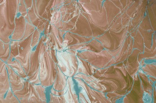 Free Vibrant abstract fluid art with swirls of earthy browns intertwined with bright blue accents. Stock Photo