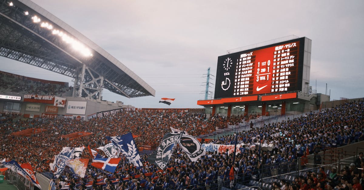 A vibrant soccer match with cheering fans at a packed stadium showcasing team spirit.