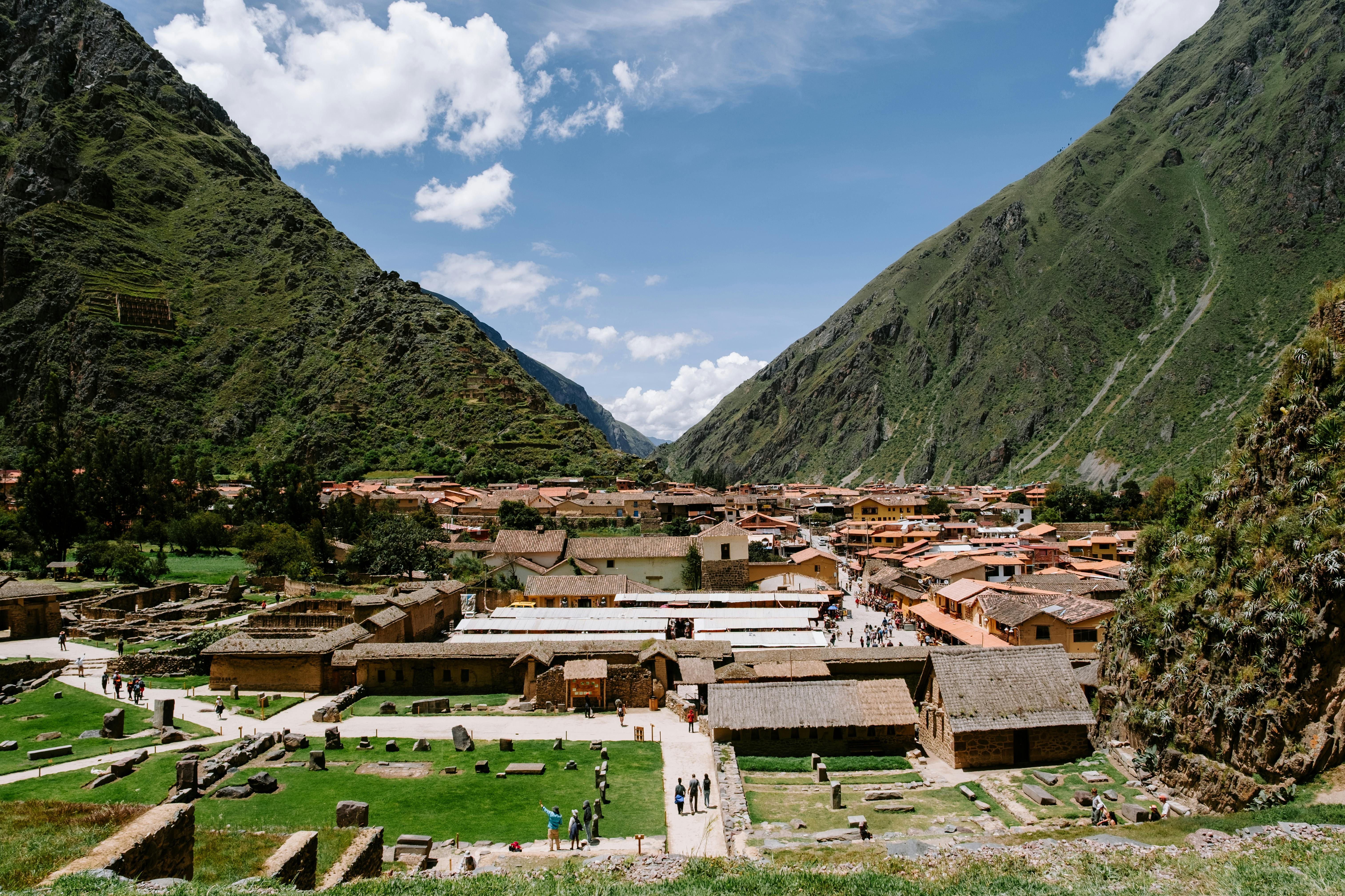 Explore the stunning Inca ruins of Ollantaytambo, Peru, set amidst the Andes mountains.