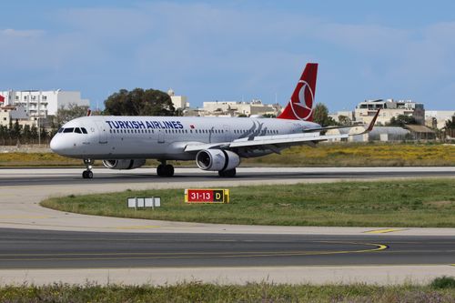 Free Turkish Airlines aircraft taxiing on runway at airport. Stock Photo