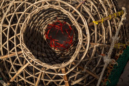 Free Close-up of a handmade woven basket showing intricate patterns and textures. Stock Photo