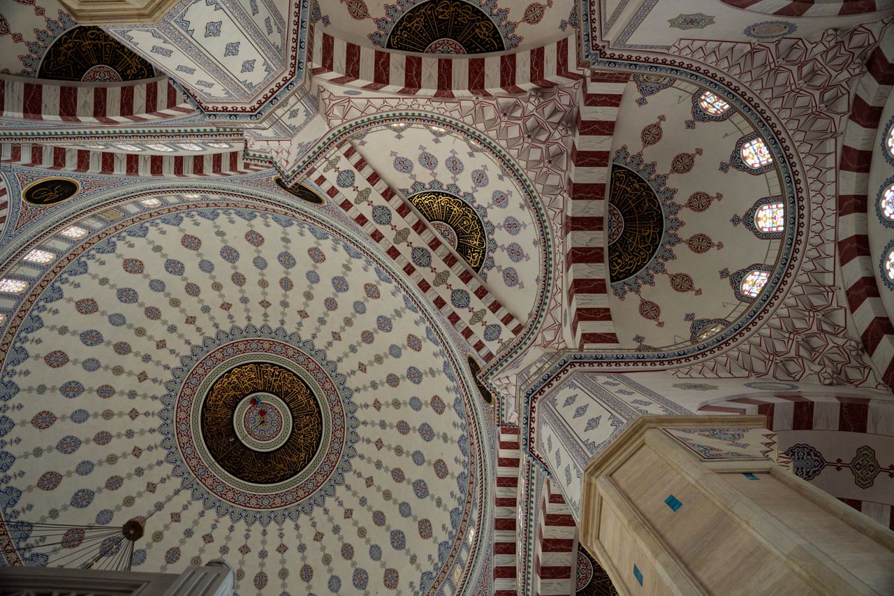 explore the intricate patterns and design of a mosque ceiling dome cap