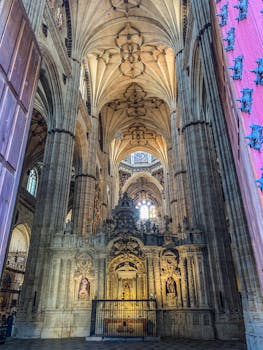 Stunning interior of a Gothic cathedral featuring a detailed altar.