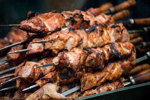 Juicy grilled shashlik skewers stacked outdoors, showcasing vibrant barbeque textures in Moldova.