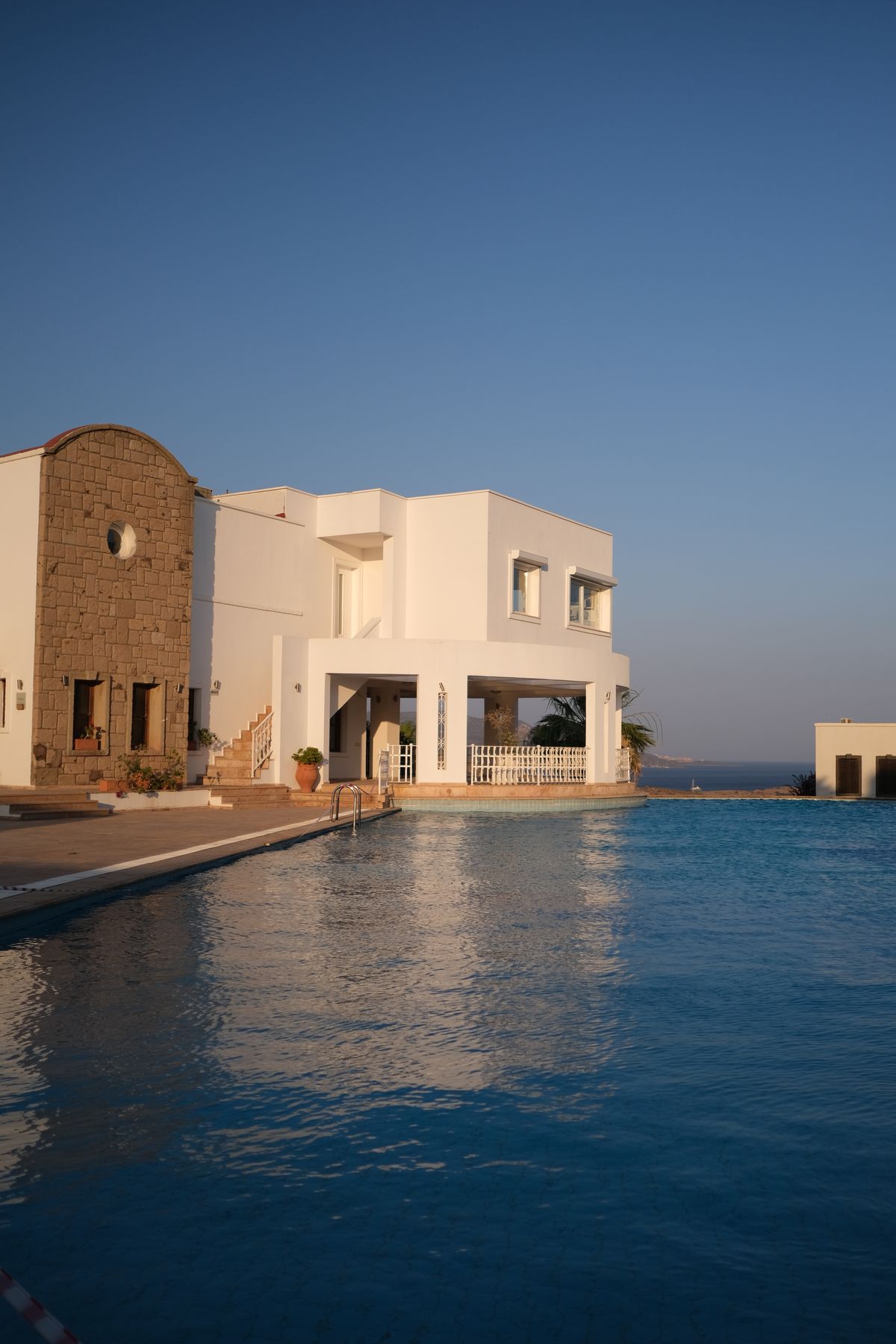 Elegant Mediterranean villa with pool and sea view at sunset
