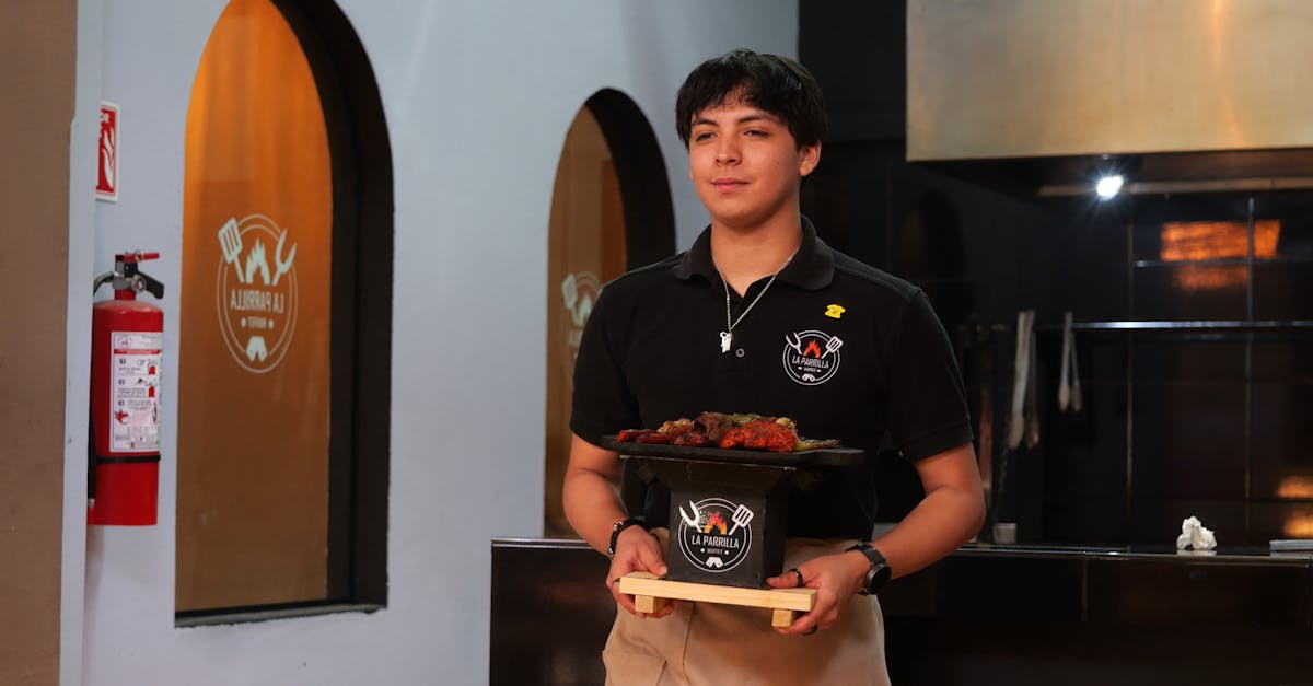 Waiter Serving Food In A Restaurant With A Confused Expression, Looking At A Menu