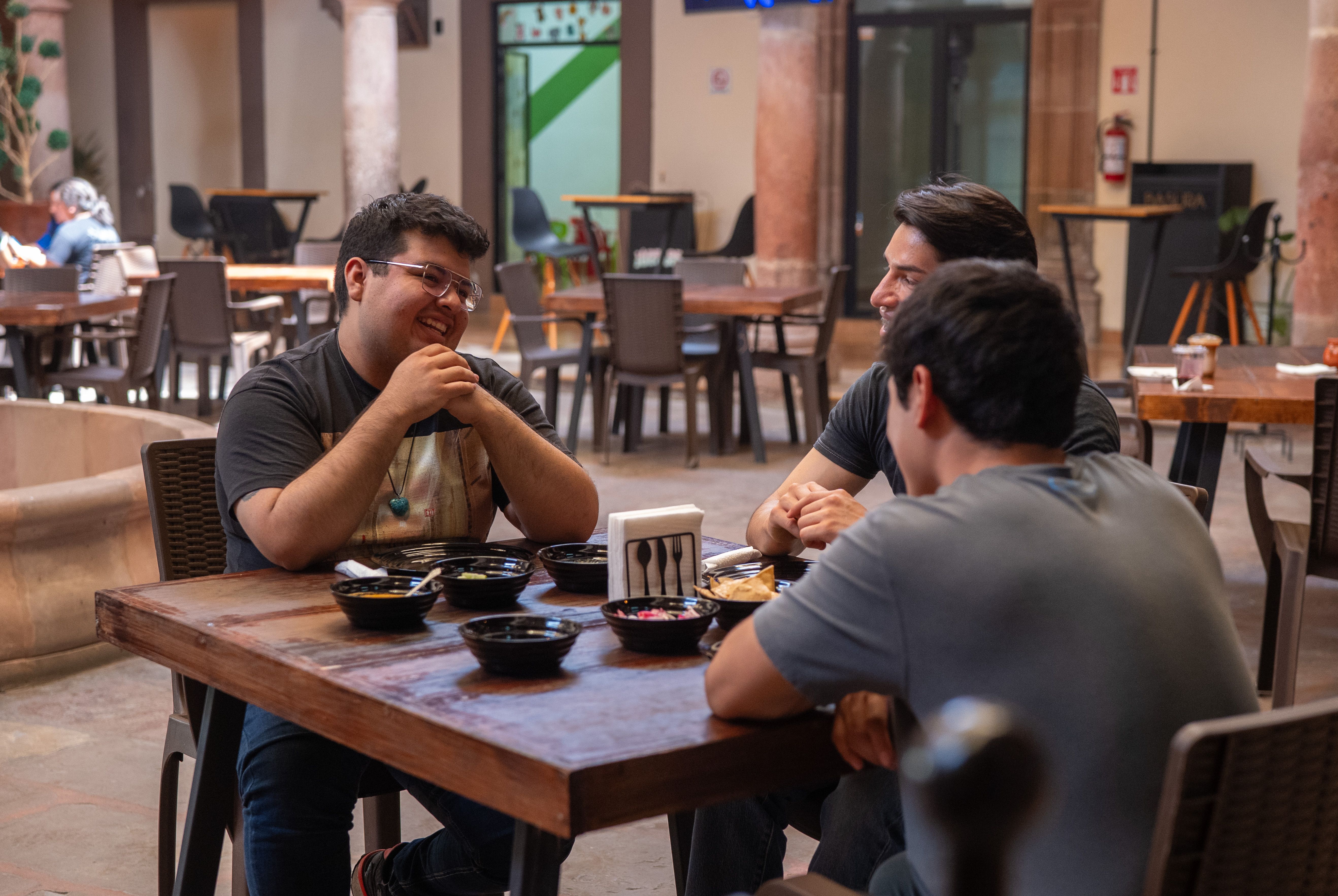 Friends sharing a meal at a Mexican restaurant