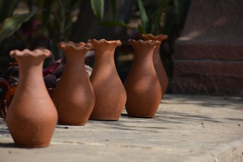 Free Sunlit terracotta vases displayed outdoors in New Delhi, capturing traditional Indian craftsmanship. Stock Photo