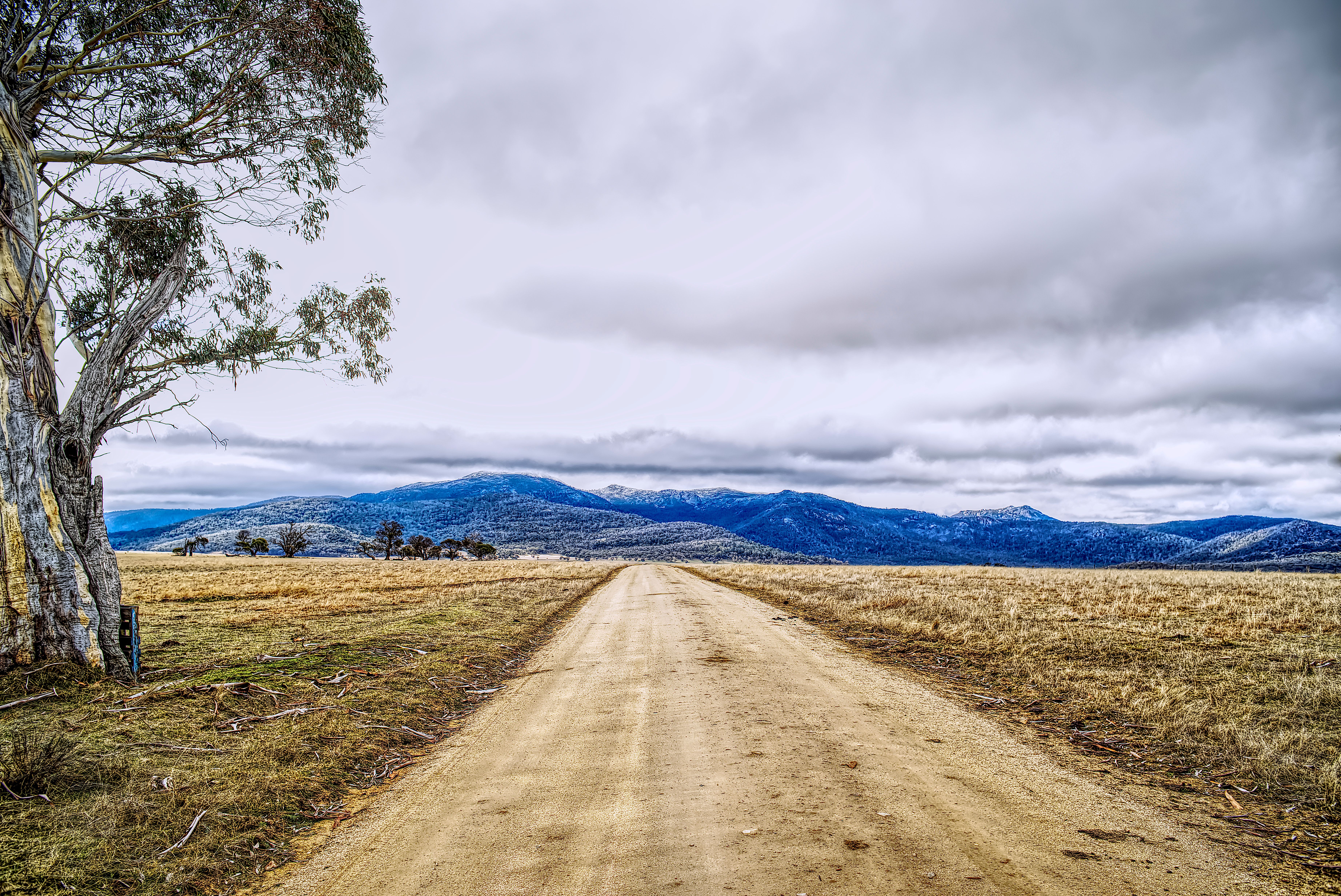 An open road winding through the Southern Tablelands countryside