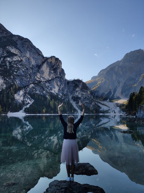 Woman Standing on Rock