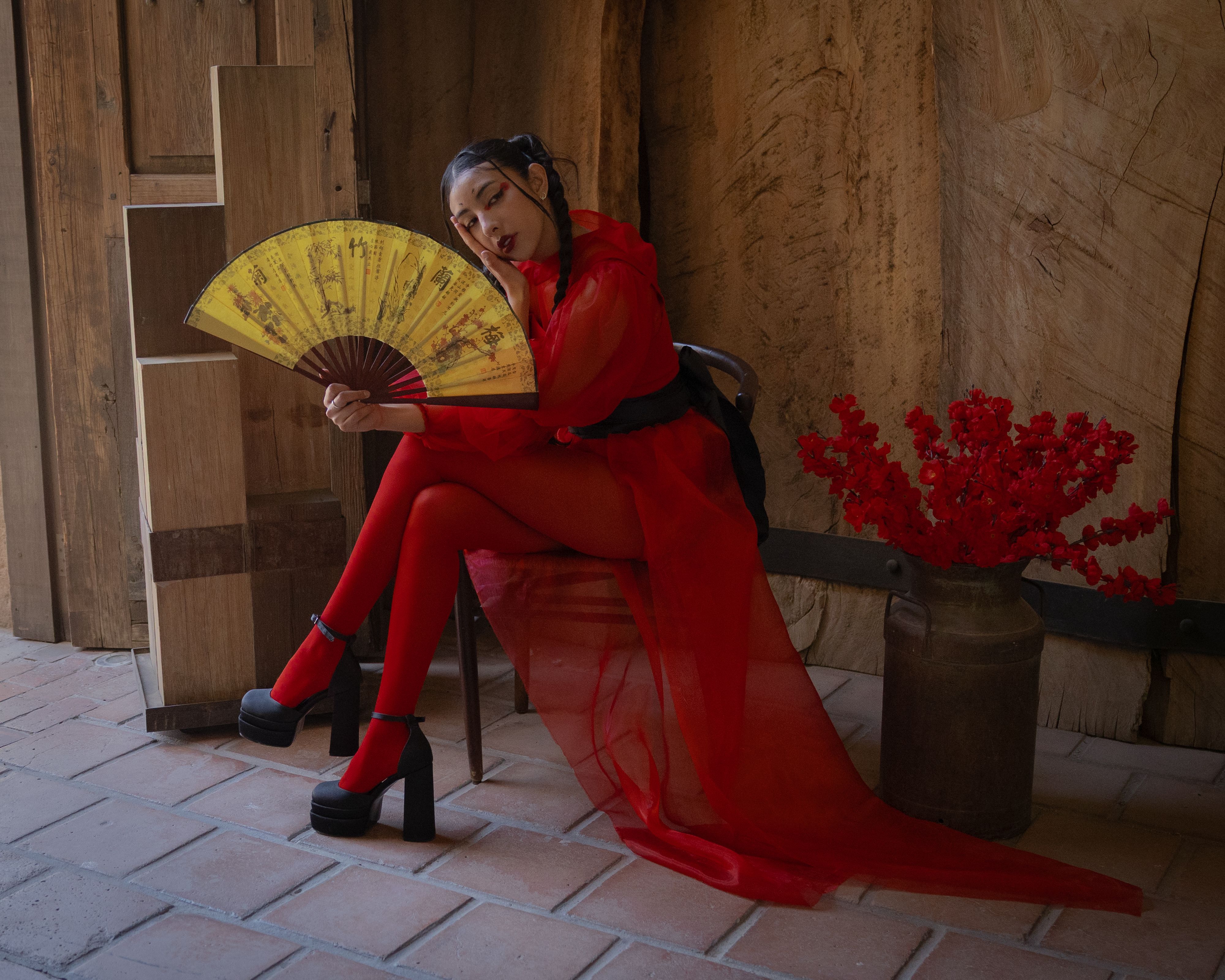 Elegant Woman in Red with Traditional Fan · Free Stock Photo
