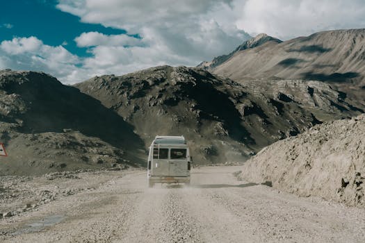 Captivating mountain drive in Marango Rangarik, Himachal Pradesh, showcasing rugged terrain under a bright sky.