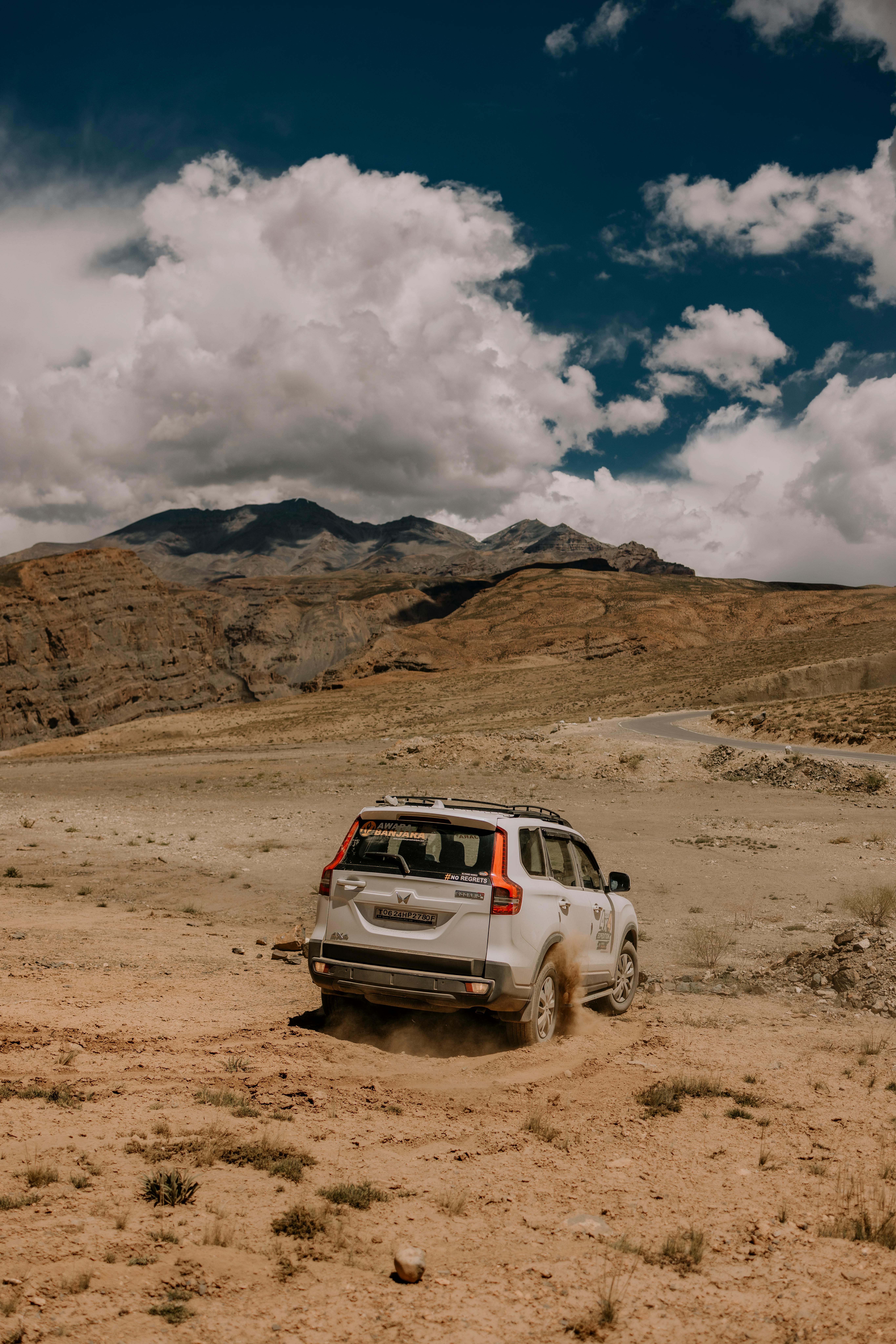 A rugged SUV navigating the arid landscape of Marango Rangarik, Himachal Pradesh, India.