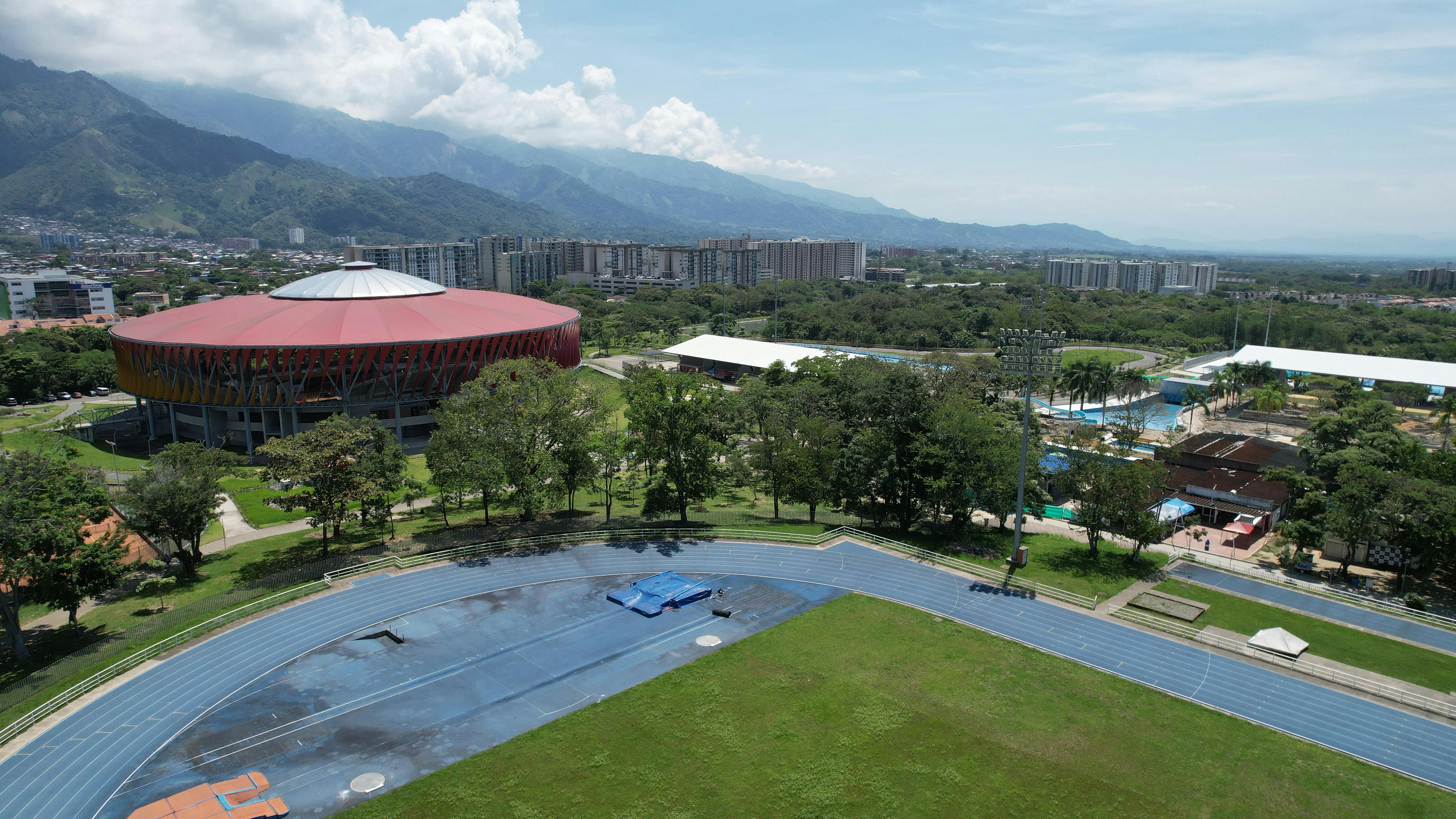 aerial view of Christ Embassy Loveworld Arena Ho with modern glass architecture and surrounding greenery