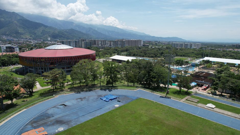 Outstanding Helicopter Experience over Cartagena and Sunset Cruise Review 2026 - Aerial image showcasing the sports complex and mountain range of Ibagué, Colombia under a clear sky.