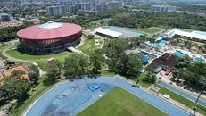 Aerial photograph of vibrant sports complex in Ibagué, showcasing the city's modern amenities and lush greenery.