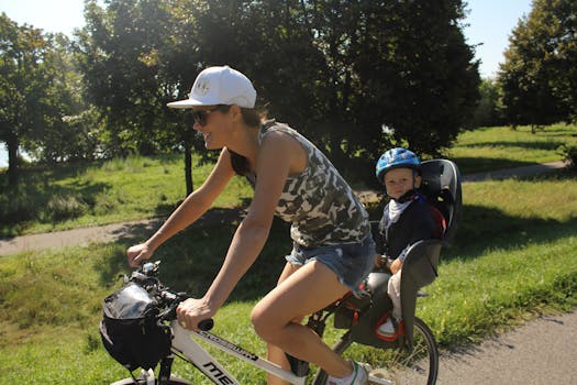 A mother and child enjoy a sunny bike ride in a Slovakian park.
