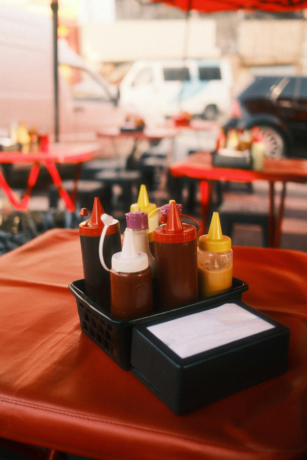 Outdoor Street Food Vendor Condiments Setup · Free Stock Photo