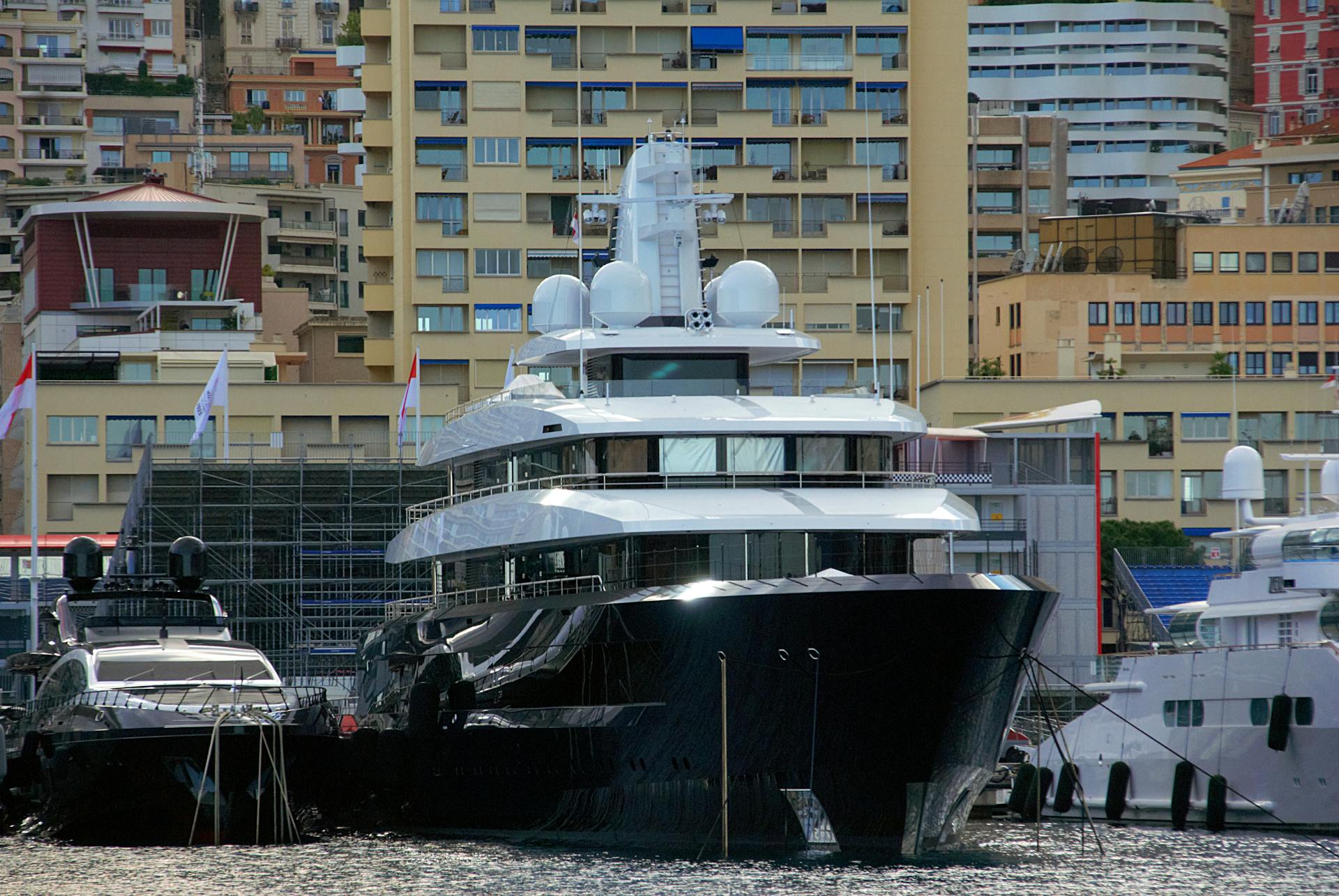 A luxurious yacht moored in the vibrant Monaco harbor, showcasing nautical elegance against the city's backdrop.