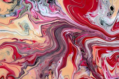 Free Dynamic swirl of red, beige, and pink hues in an abstract fluid art style. Stock Photo