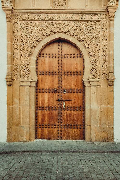Free A beautifully engraved wooden door in Rabat, showcasing traditional Moroccan architecture with intricate designs. Stock Photo