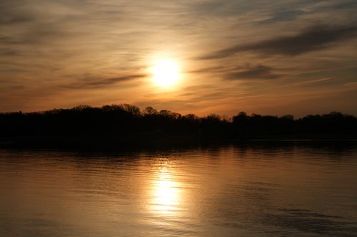Free Peaceful sunrise reflecting on the water in Stamford, Connecticut, creating a tranquil scene. Stock Photo