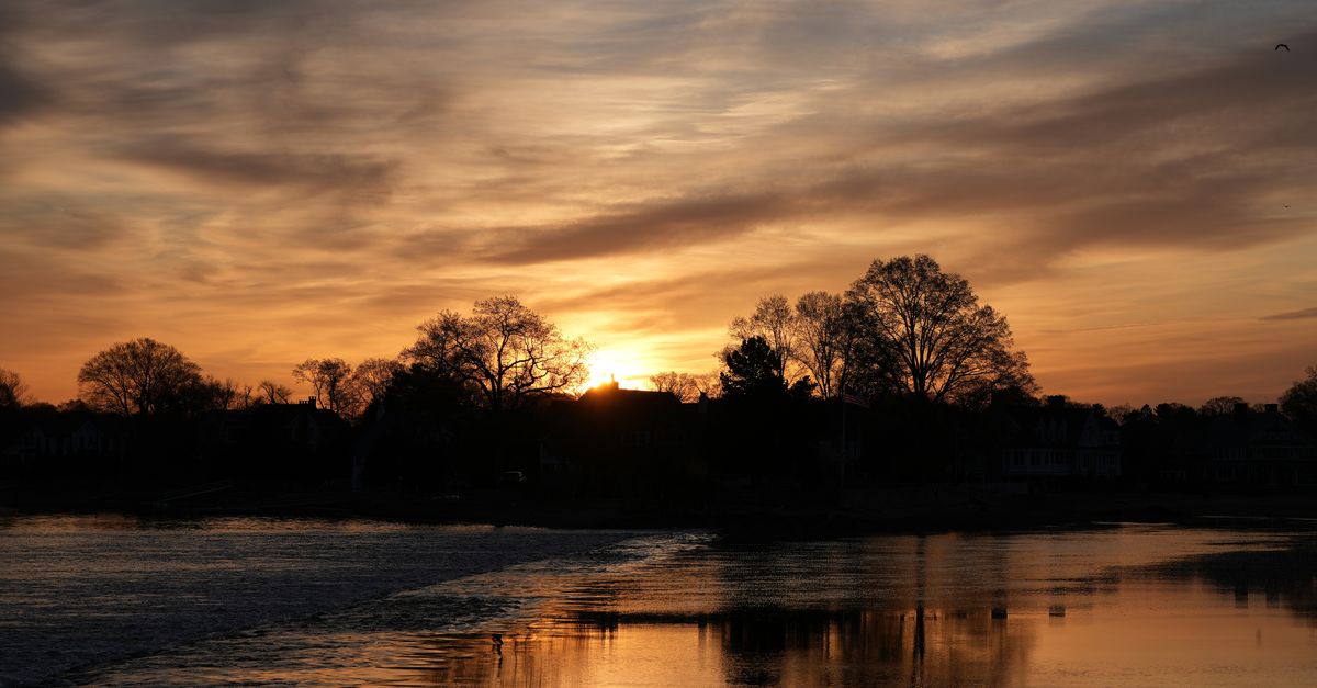 Captivating sunrise view over Cove Island Park in Stamford, Connecticut, reflecting on calm waters.