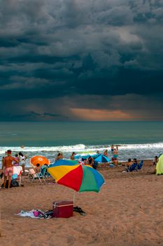 Capture of a vibrant beach day in Mar de Ajó under dramatic skies.
