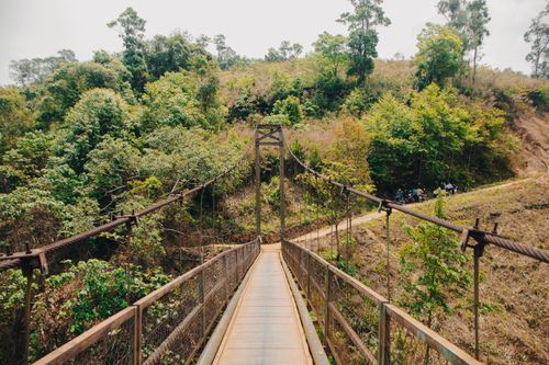 Free Explore the scenic suspension bridge across lush greenery in Gia Lai, Vietnam. Stock Photo