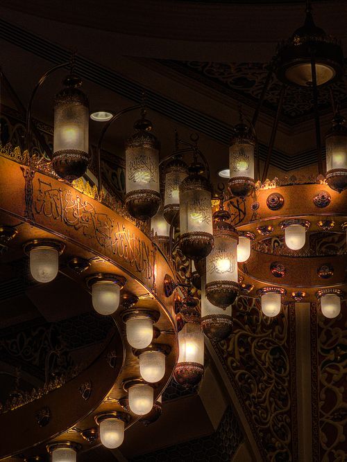Free Vintage chandelier with intricate design lighting up a classic interior setting, highlighting art and elegance. Stock Photo