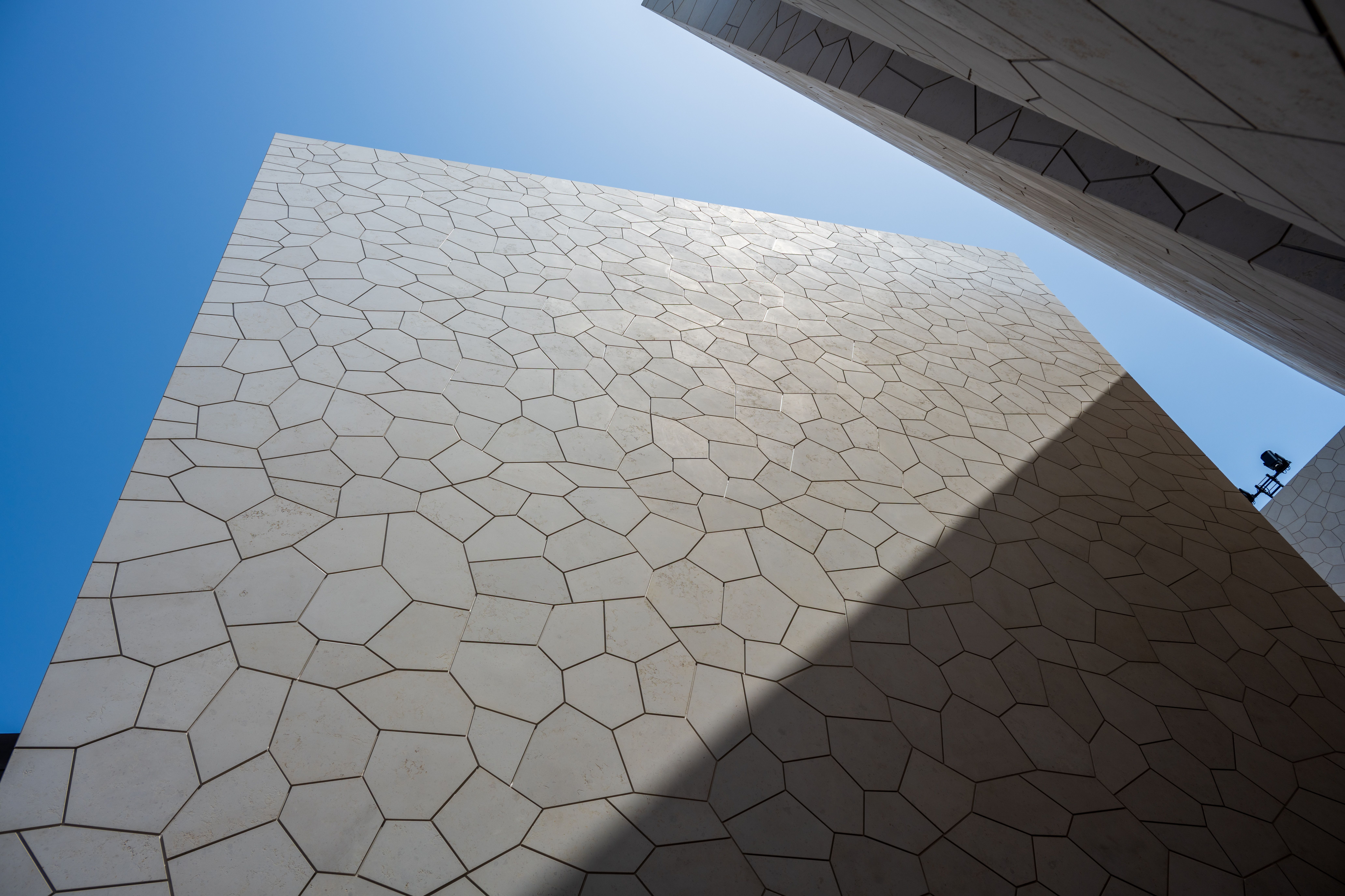 Modern Geometric Building Facade with Blue Sky · Free Stock Photo