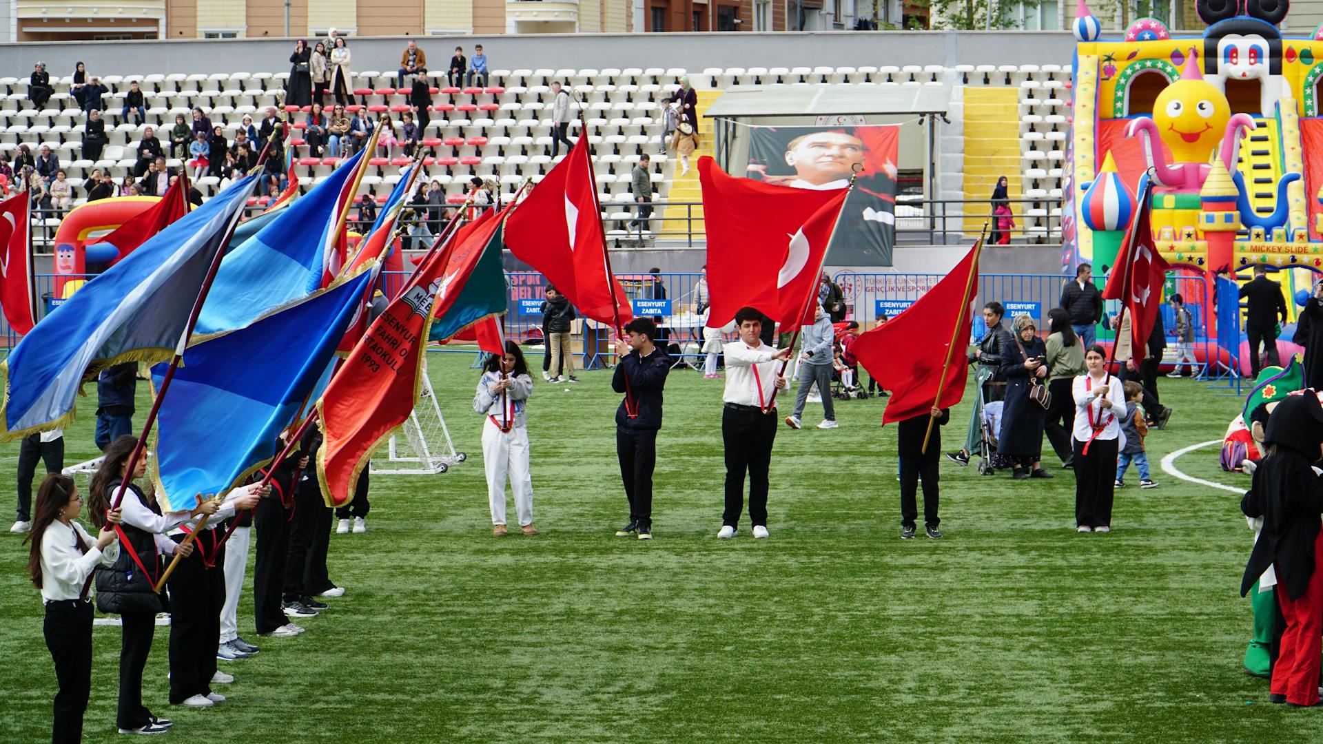 Colorful children's festival in Istanbul featuring flags and cultural celebration outdoors.