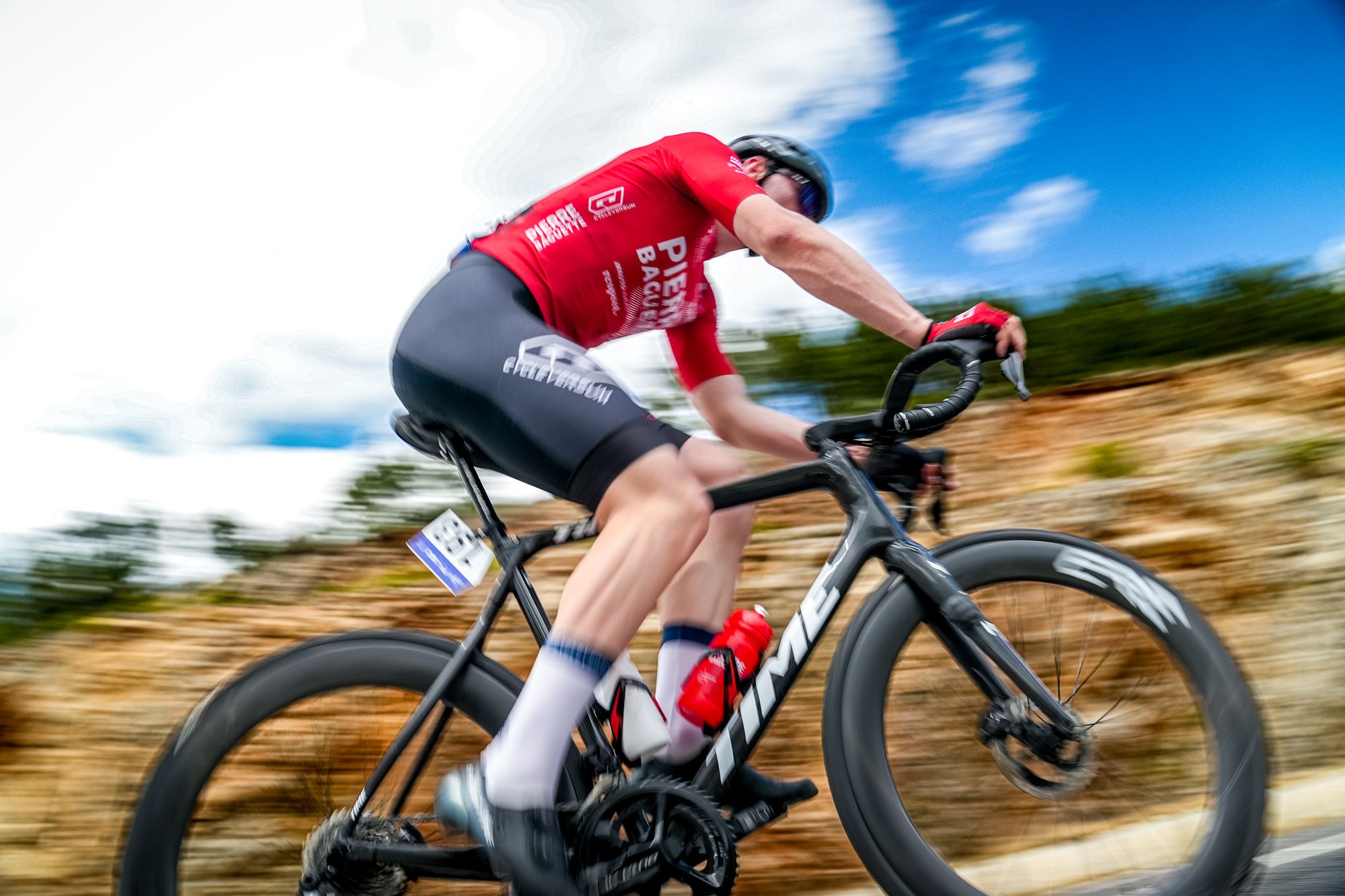 Dynamic shot of a cyclist racing on a mountain road in Mersin, Türkiye.