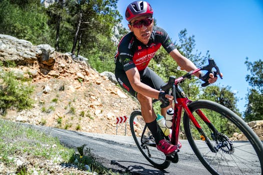 Cyclist in action on a mountain road in Mersin, Türkiye, showcasing determination and skill.