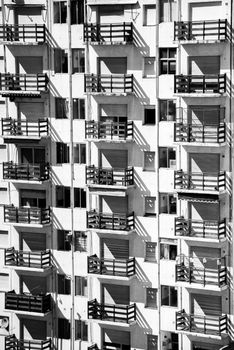 Black and white photo of apartment balconies in Mar del Plata, Argentina, showcasing urban life.