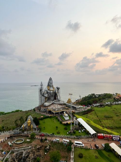 Free Stunning aerial shot of the iconic Lord Shiva statue at Murdeshwar Temple, India, at sunset. Stock Photo