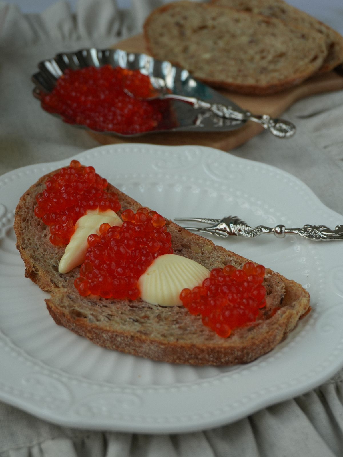 A caviar tin label displaying the CITES certification code, Latin species name Acipenser gueldenstaedtii, and clear production and expiry dates