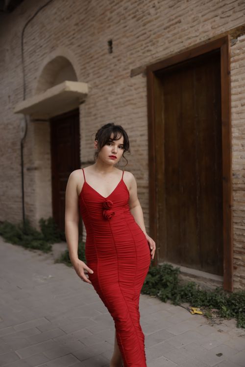 Elegant Woman in Red Dress in Rustic Alley · Free Stock Photo