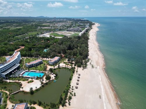 Free Stunning aerial view of Hồ Tràm beach with luxury resorts and lush greenery in Vietnam. Stock Photo