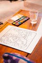 Watercolor Art Setup on a Wooden Table