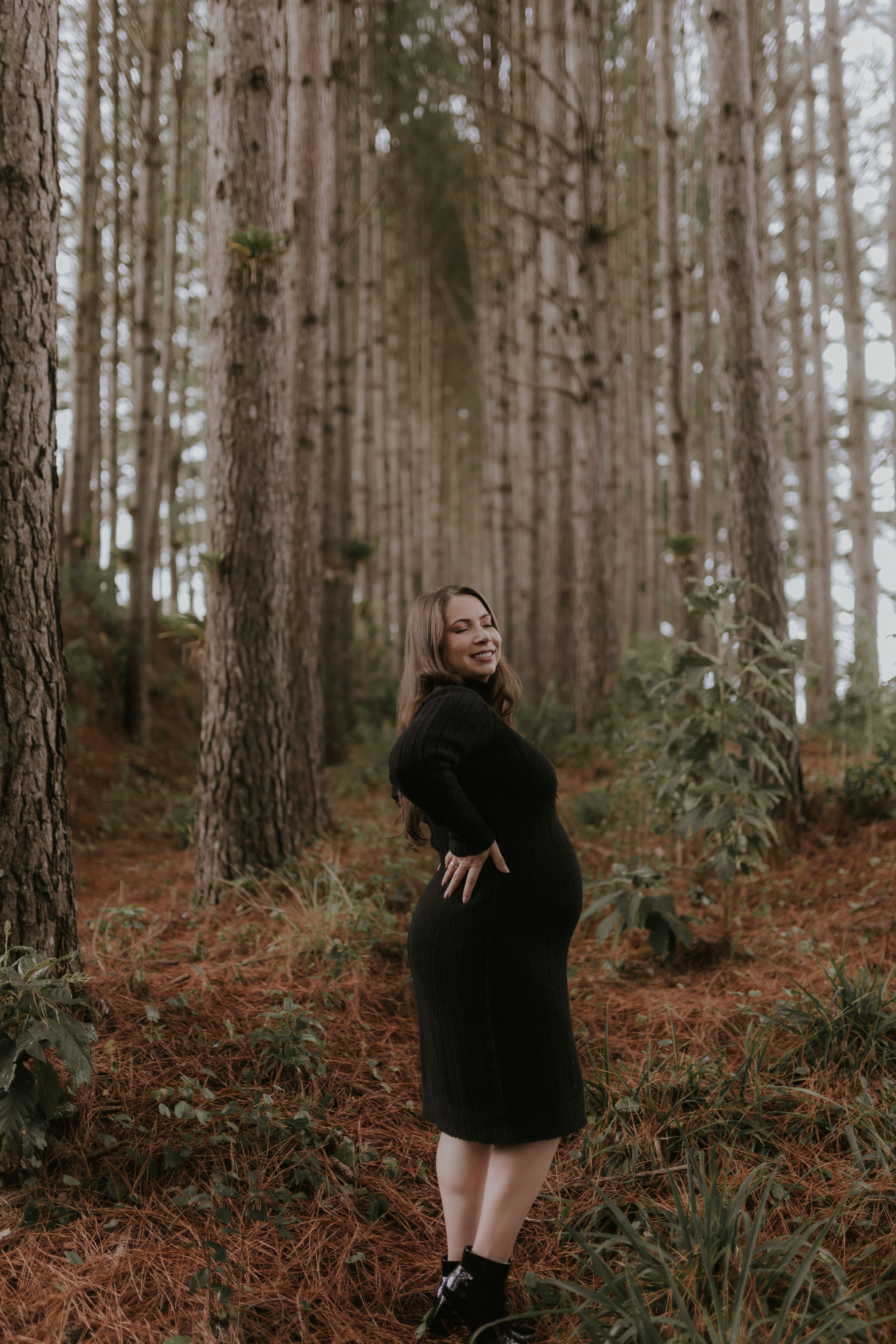 Pregnant Woman Posing in Serene Pine Forest · Free Stock Photo