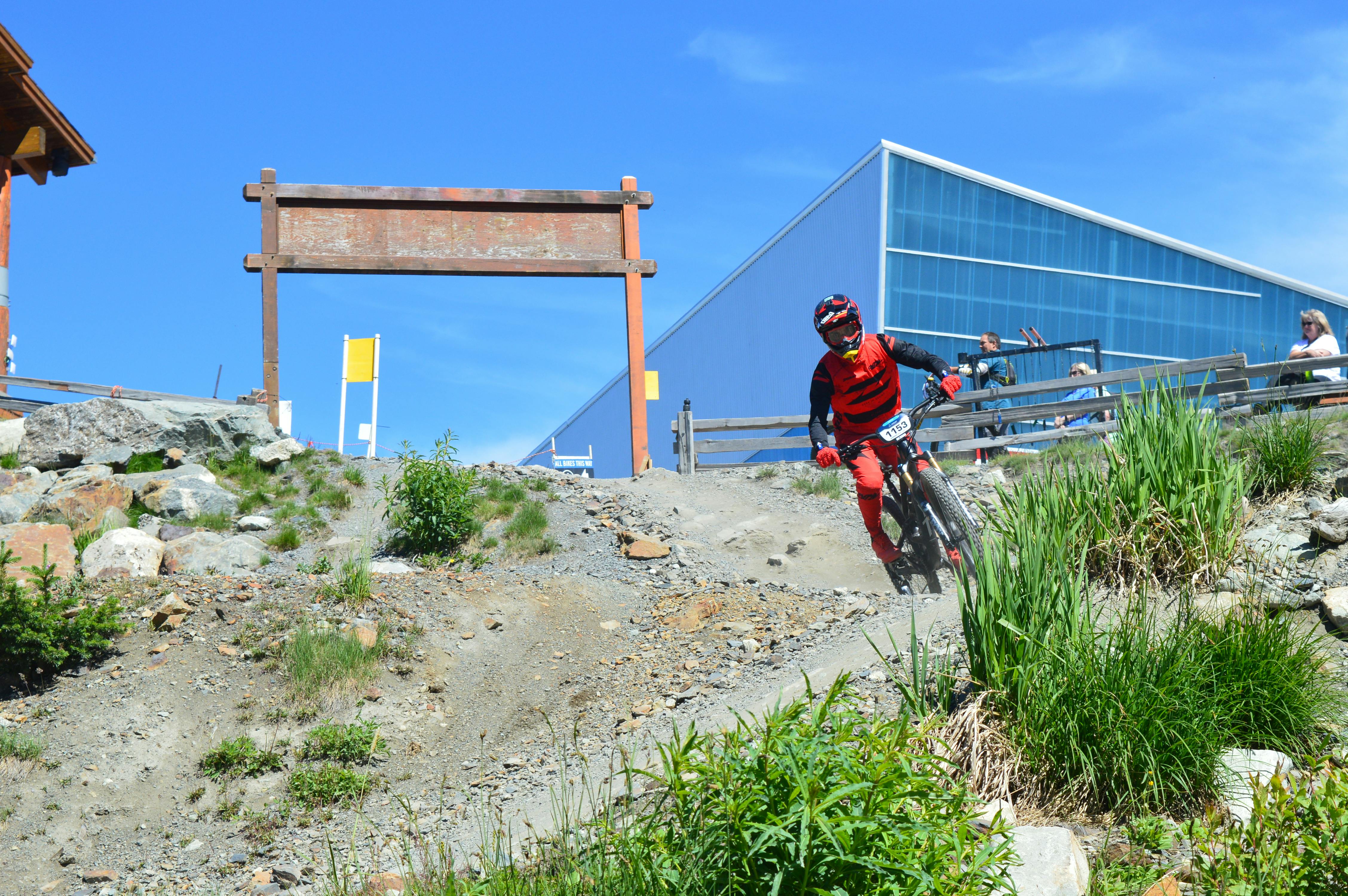 Exciting downhill mountain biking action captured in Whistler, BC, with a cyclist in motion.