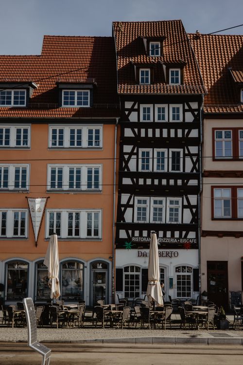 Free Charming half-timbered buildings in Erfurt, Germany, with outdoor cafes. Stock Photo