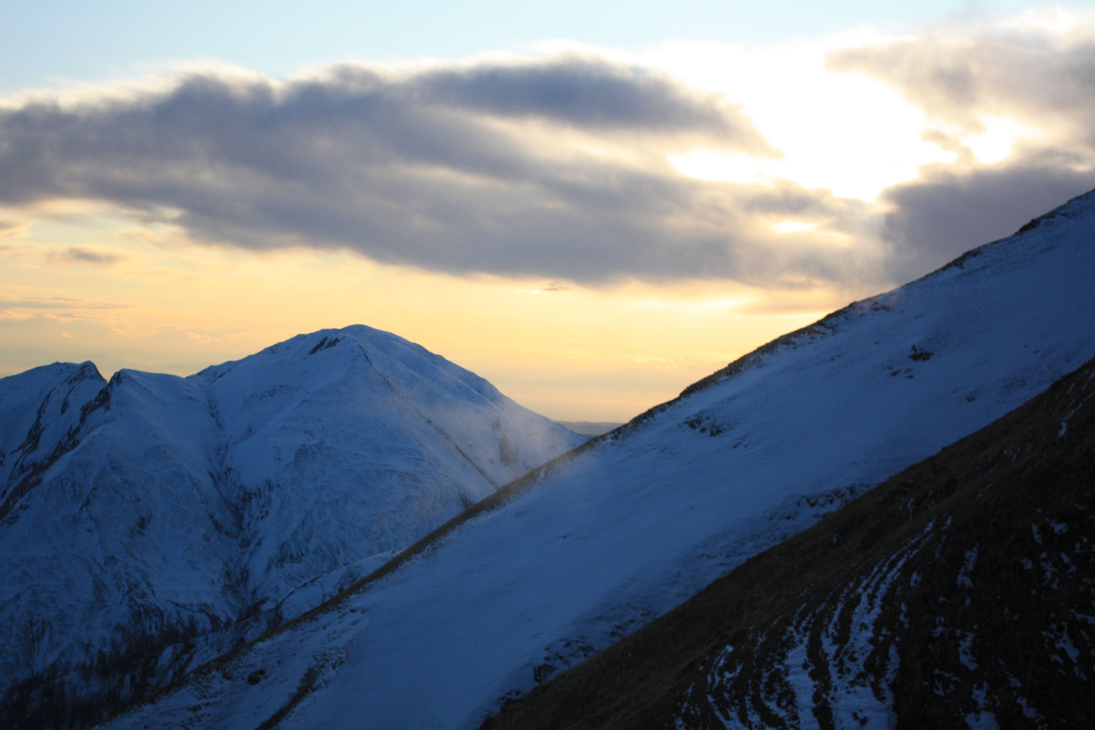 Breathtaking Sunset Over Snowy Mountain Peaks · Free Stock Photo