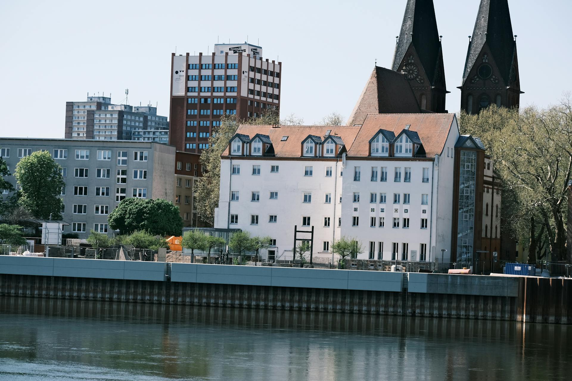 Charming urban waterfront scene with historic and modern architecture in view.
