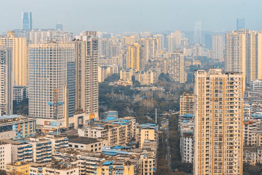 A cityscape showcasing a dense array of skyscrapers under a clear daytime sky, highlighting urban architecture.
