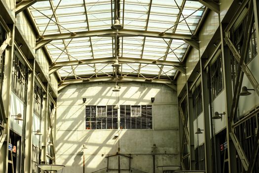 Spacious industrial warehouse interior with glass roof, allowing natural light to flood the space.. pexels, spacious, industr