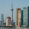 The modern skyline of Shanghai's Lujiazui financial district featuring prominent banking towers and the Oriental Pearl Tower.